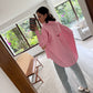 CAMISA ROSA ASIMÉTRICA