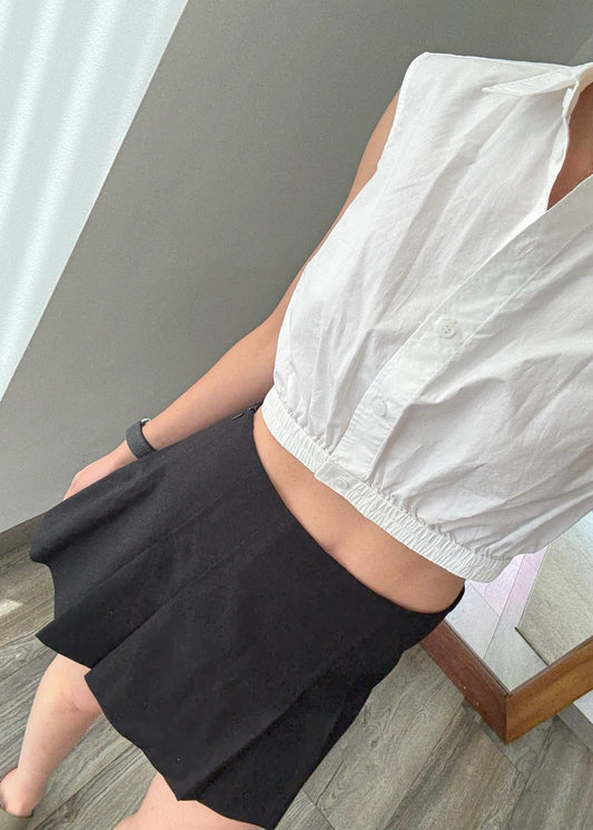 FALDA PLIZADA NEGRA MINI