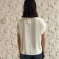 TOP CUELLO ALTO CON BOTONES