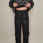 PANTALÓN NEGRO CON CORTES