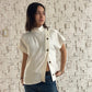 TOP CUELLO ALTO CON BOTONES